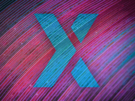 Blue X, representing the Poloniex logo, in front of a purple/blue background.
