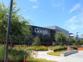 Google Headquarters (also called Googleplex) with greenery in front of it.